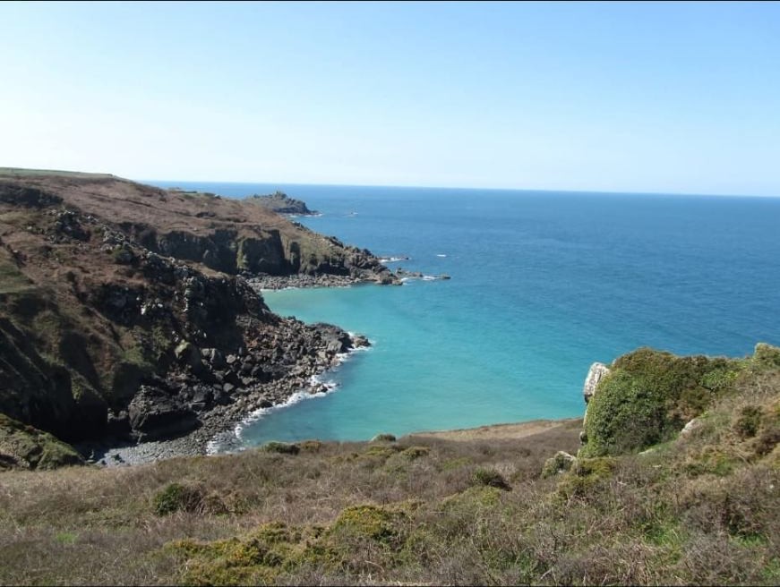 Turquoise water and granite cliffs on the Cornish coast